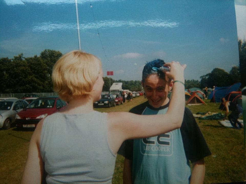 Me at Reading 2001 with my sister putting blue hair dye on me